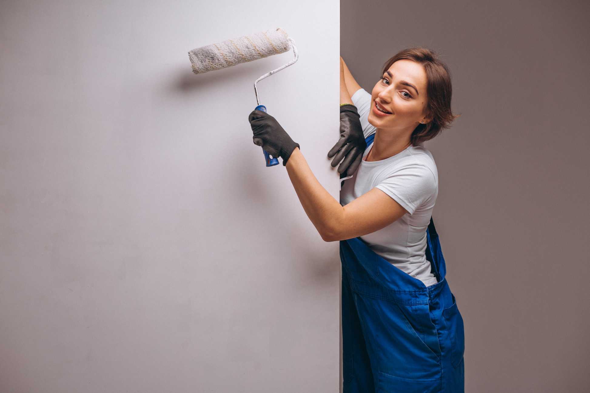 woman-repairer-with-painting-roller-isolated